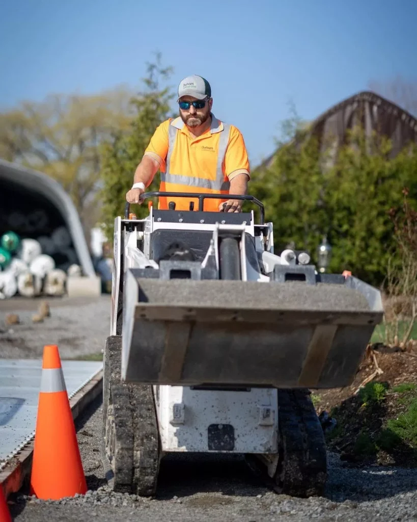 Worker operating the loader machine