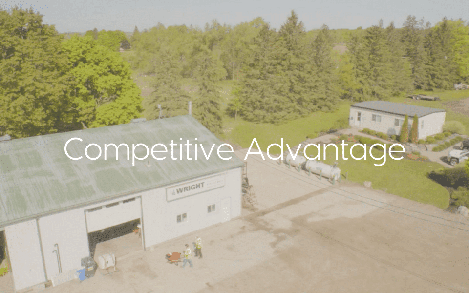 "Competitive-Advantage" text over image of company yard