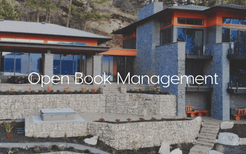 "Open Book Management" - Text over image of stone scape