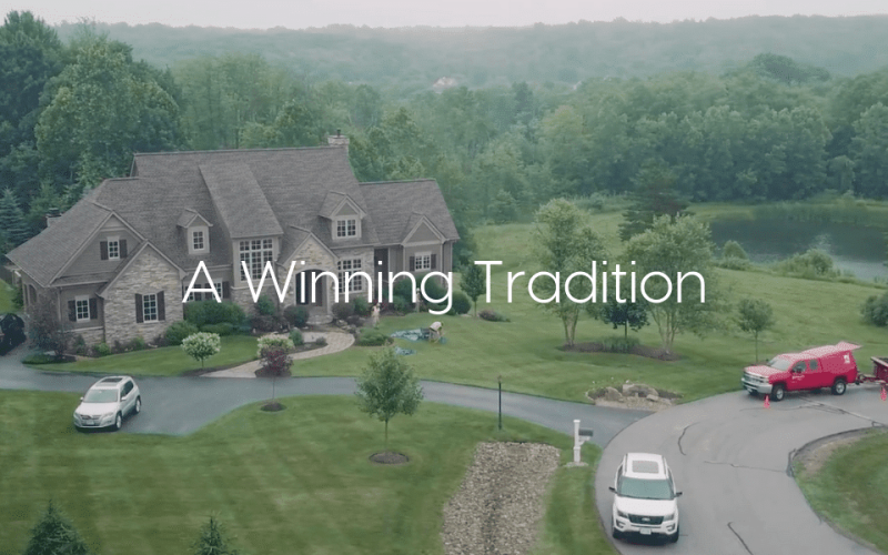 "Winning Tradition" - Text over image of large estate