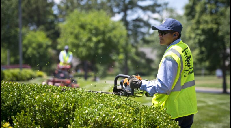 Banner image of a man landscaping for the blog How to Price Landscaping Jobs