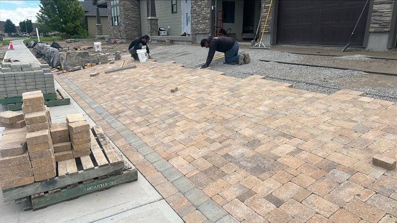 Landscapers working on a patio
